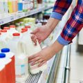 Woman shopping milk in store